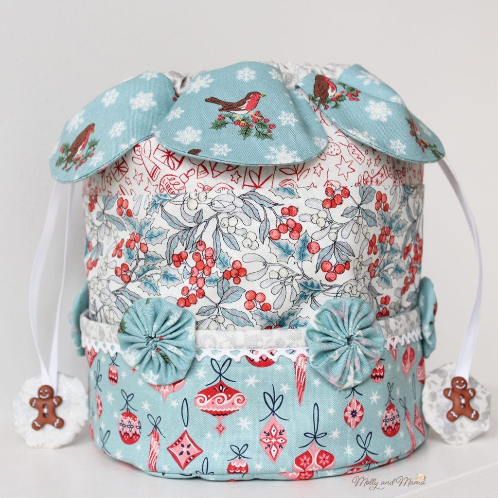 Drawstring dilly bag sewing pattern with fabric petals, pockets and yoyos 