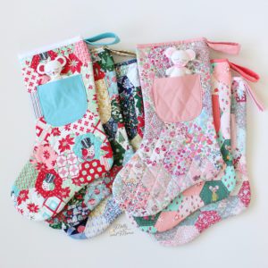 English paper pieced Christmas stocking sewing pattern with felt mouse in the front pocket